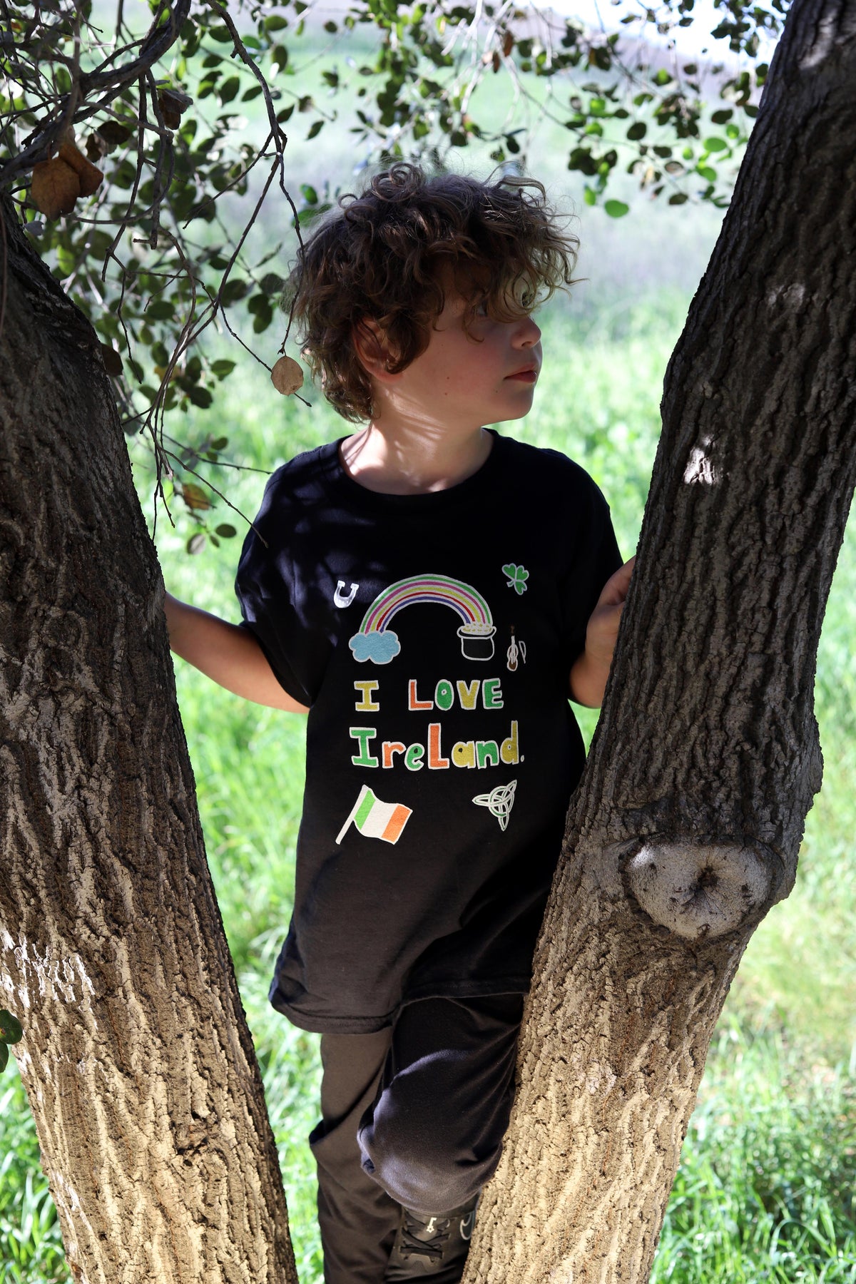 Boy wearing a 'I Love Ireland' t-shirt standing for St. Patricks Day